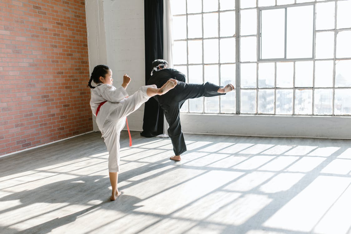 Enrolling her in a self-defense class like Karate can teach her valuable skills in both physical and mental self-defense. 